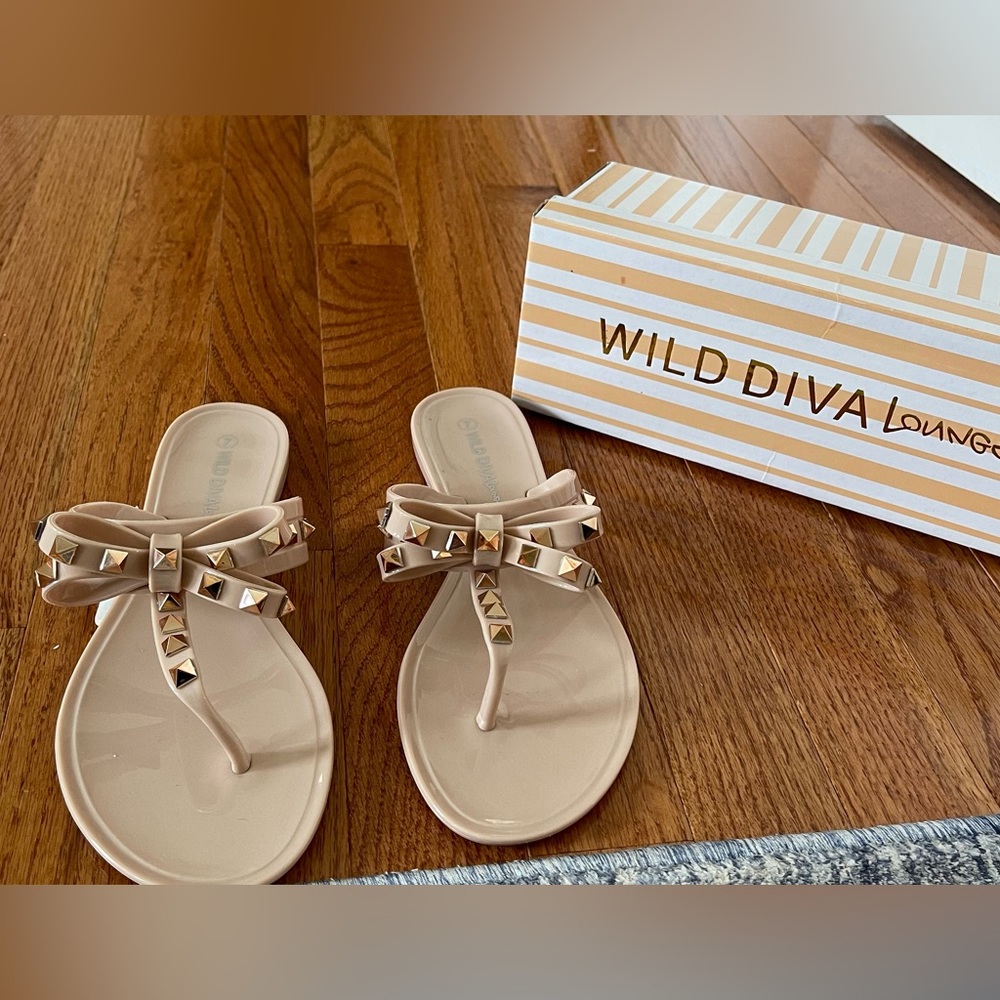 Brand new with tags, wild diva lounge, nude, flip-flops with rose gold studs.